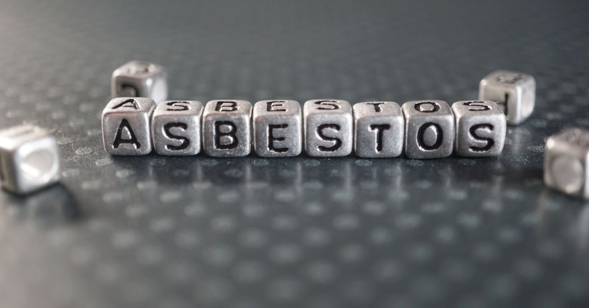 Gray blocks with black letters that spell out "asbestos"